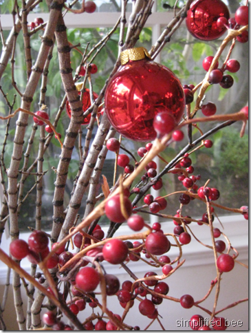 elf tabletop red glass ornaments twigs