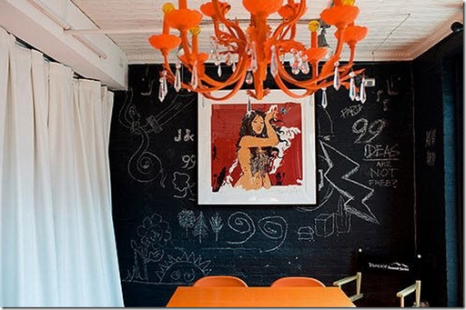orange chandelier chalkboard wall dining room