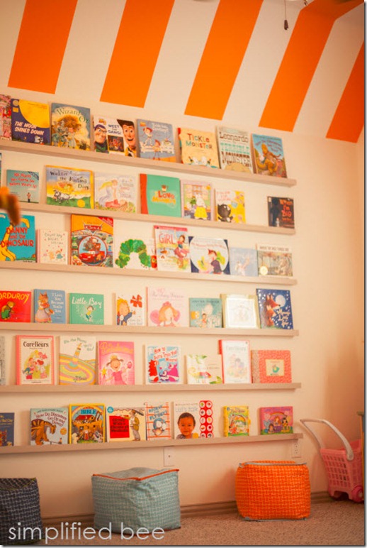 Playroom Book Wall and Orange Striped Ceiling by Simplified Bee