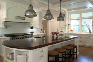 designer white kitchen with wooden island