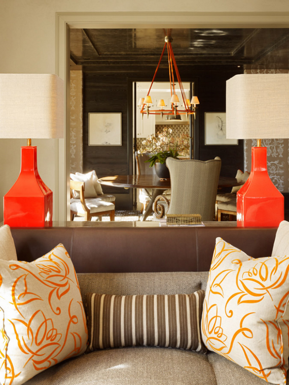 formal living room with orange lamps