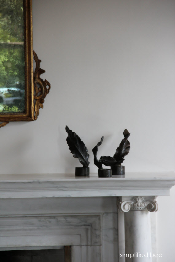 bronze feathers on marble mantel