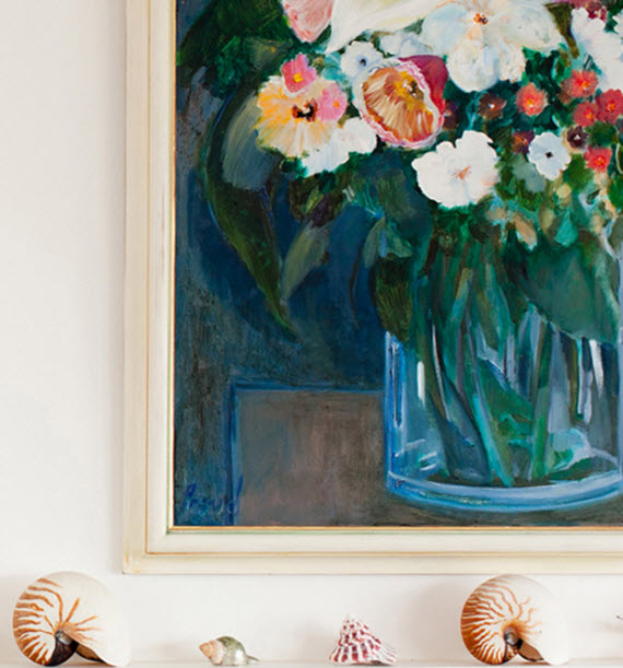 fireplace mantel with artwork and shells