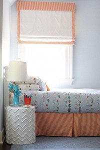 sweet boy's bedroom with orange accents