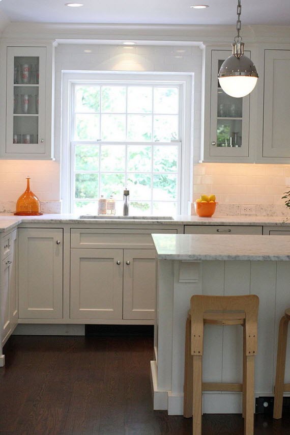 white designer kitchen with hicks pendant