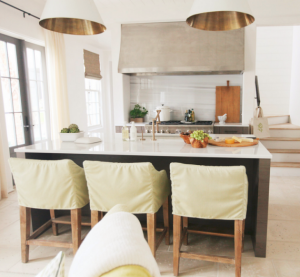 white kitchen with brass accents