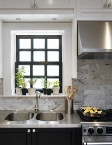 kitchen with stainless steel countertop and black window