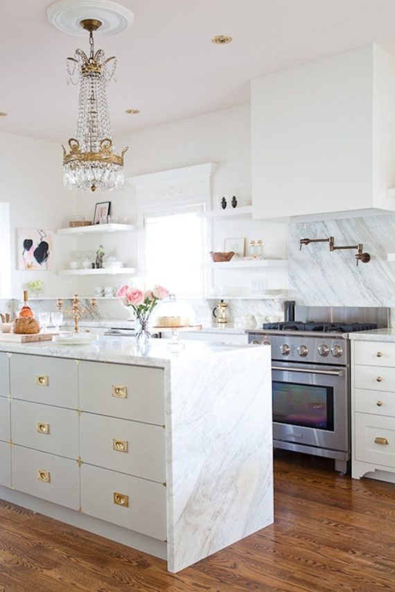 white kitchen with brass and marble