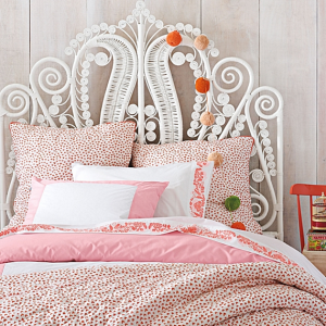white rattan scroll headboard // girl's bedroom