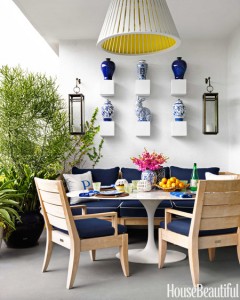 outdoor patio with saarinen table and blue sofa // Robert Passal