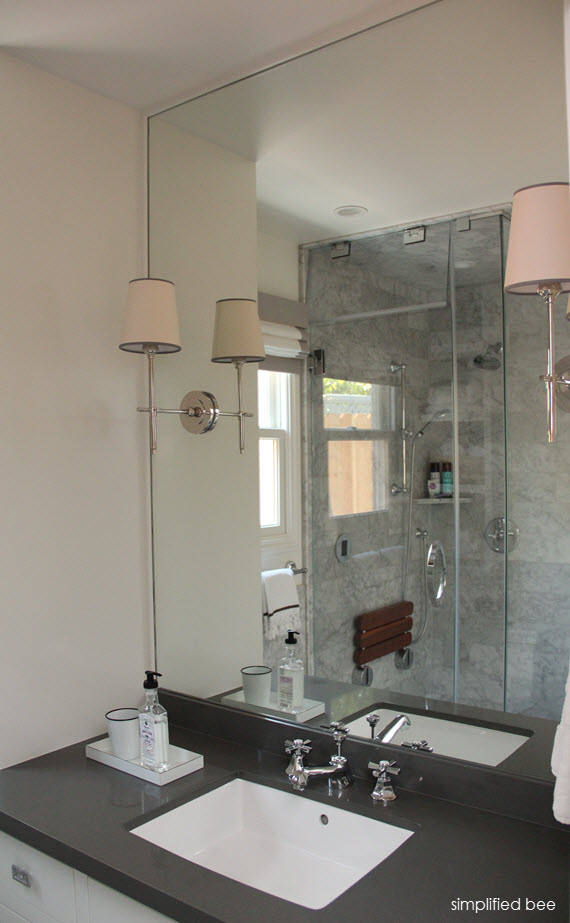 marble bathroom // mirror with scones // simplified bee design #bathrooms