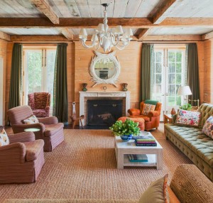 family room in earth tones // beams and wood plank walls
