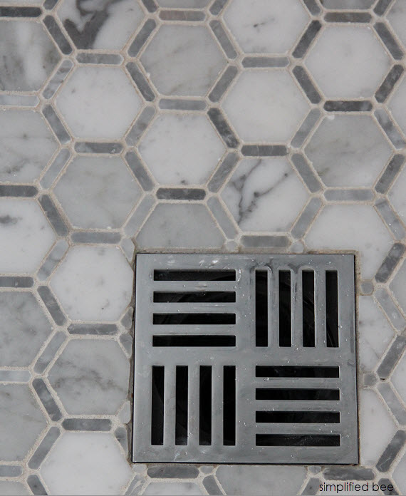 designer marble bathroom with square shower drain // cristin priest of simplified bee #bathrooms