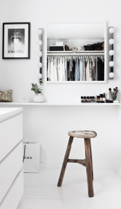 black and white walk-in-closet with vanity
