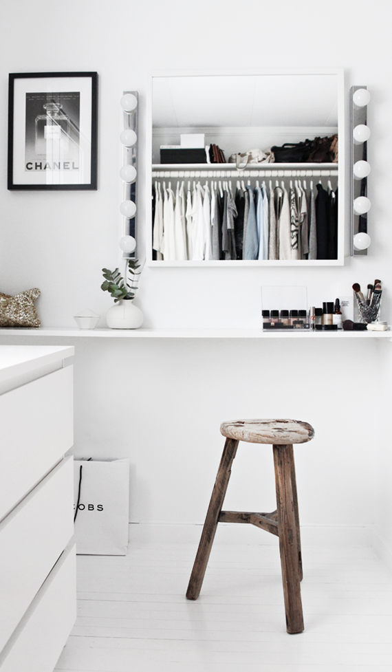 black and white walk-in-closet with vanity 