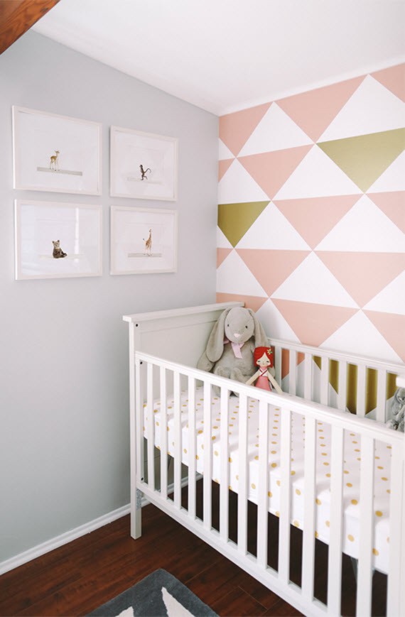 girl's nursery room // triangle accent wall in pink