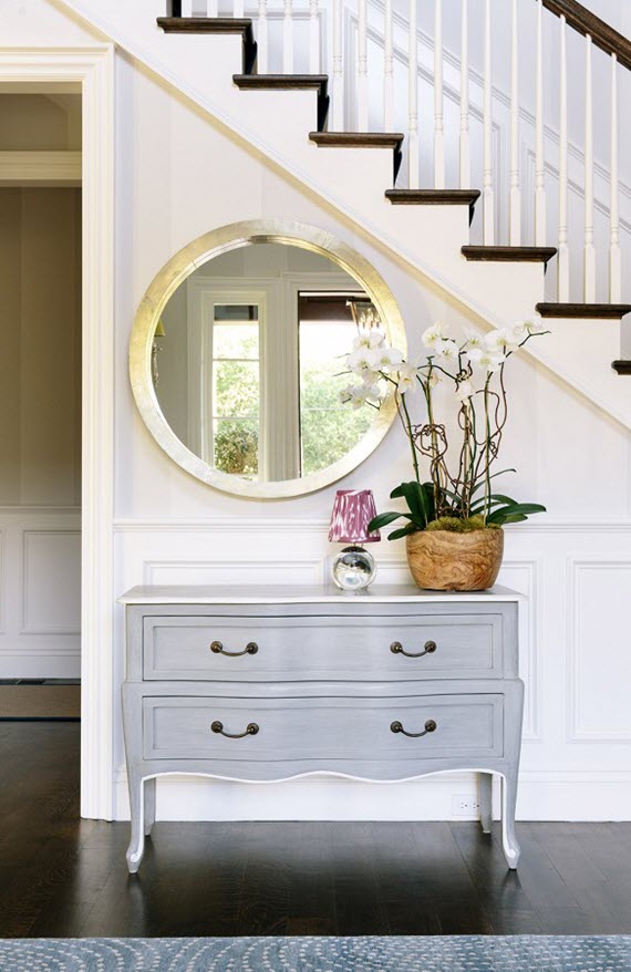entry with stairway  // console & round mirror