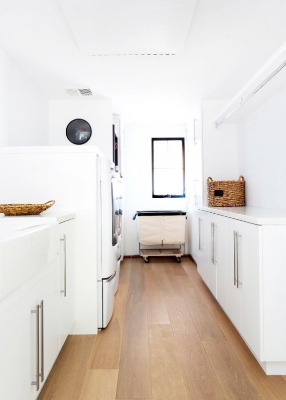 white laundry room with wooden floors // maggie pierson design